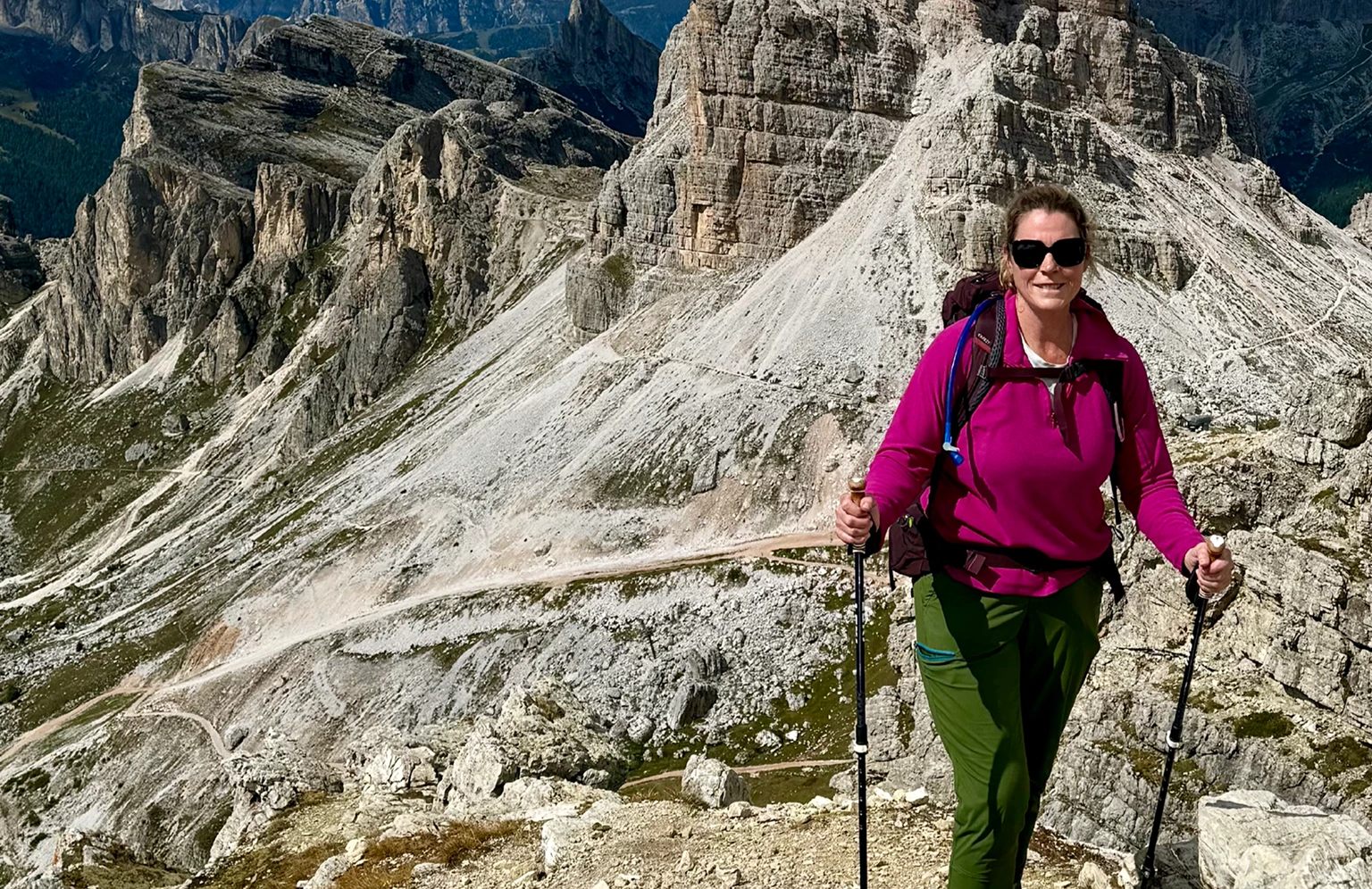 A guide leads a group of climbers, pointing toward the summit on Everest.